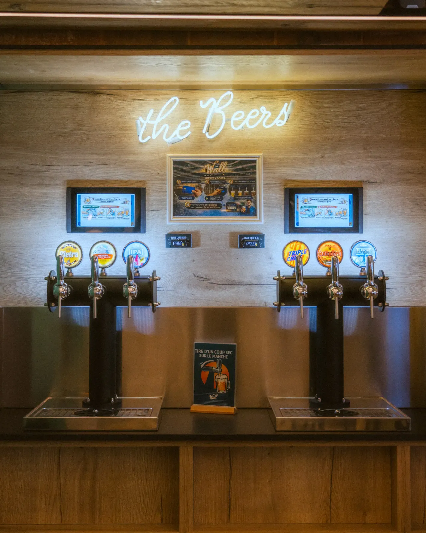 Beer bar with six beer taps and display panels above